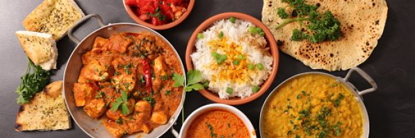 assorted of indian dish with curry dish, naan,  chicken